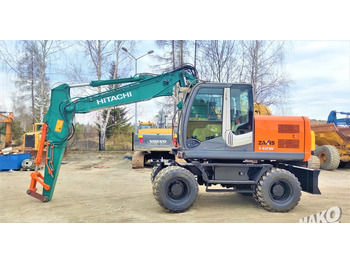 Pelle sur pneus HITACHI ZX140W-3